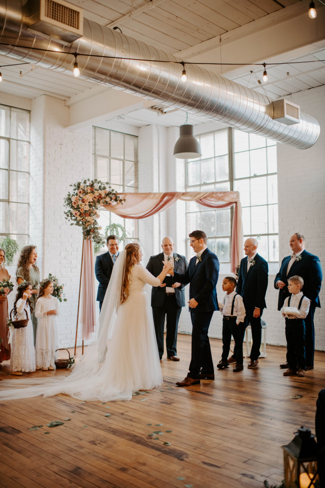 The secret handshake that McKenzie & Caleb performed for their family and friends...just before sealing the deal with "the kiss."