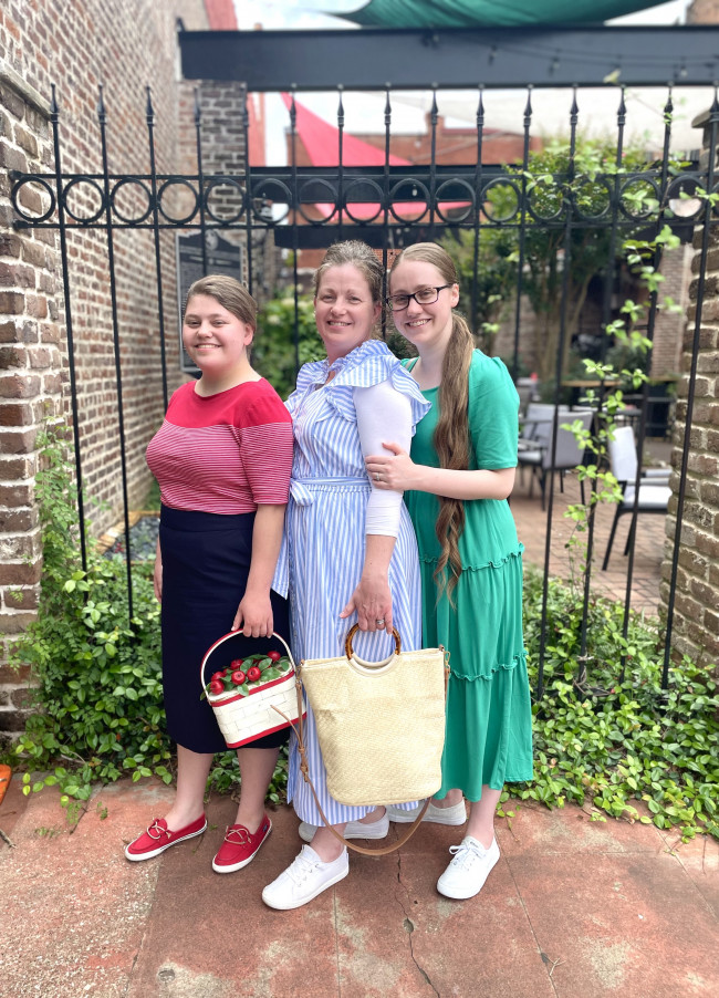 My sister, my momma, and myself outside Roma's